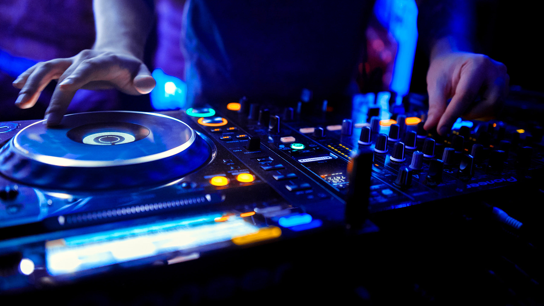 dj playing club music in nightclub