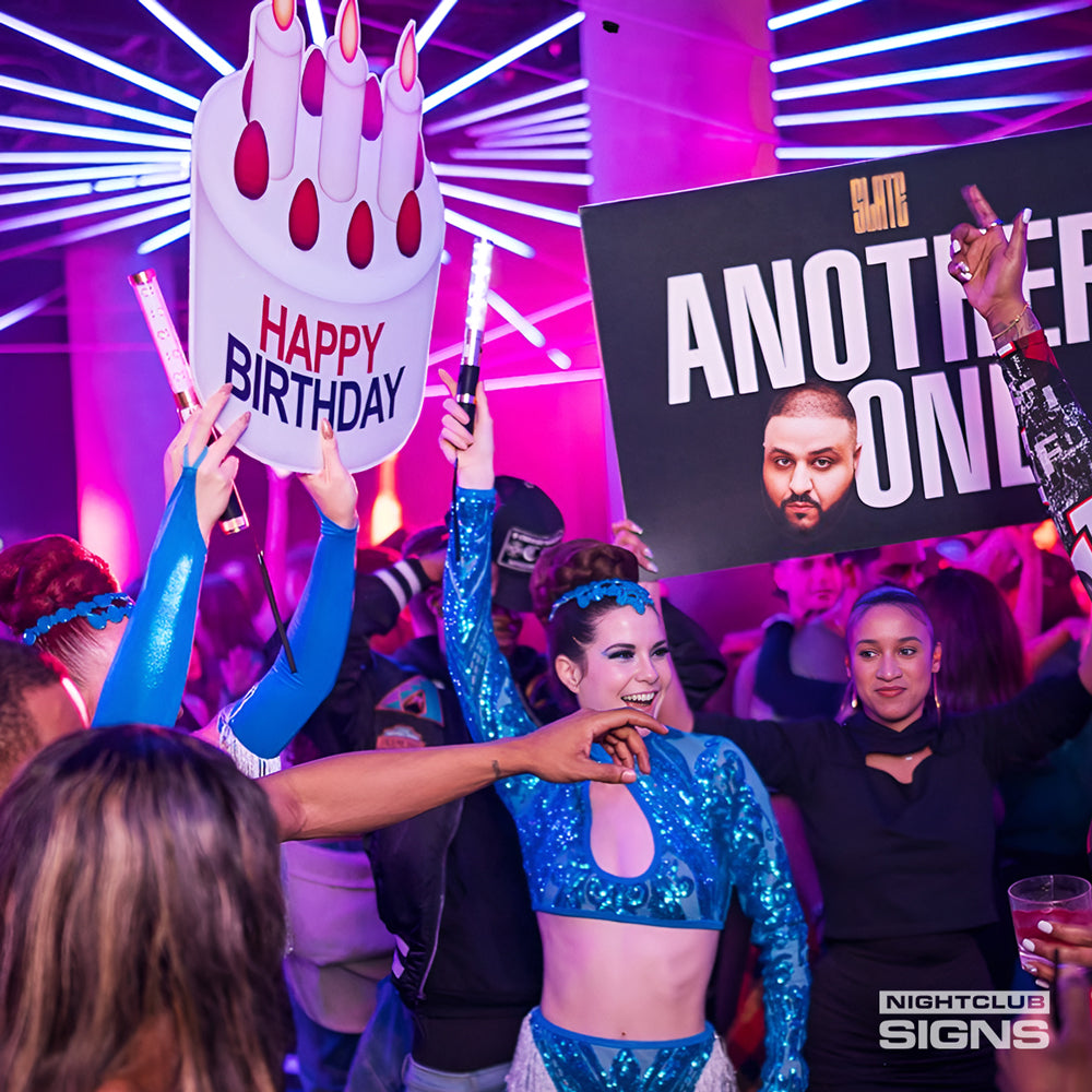 Nightclub Signs being shown by bottle servers as they show a bottle service presentation and patrons exciement