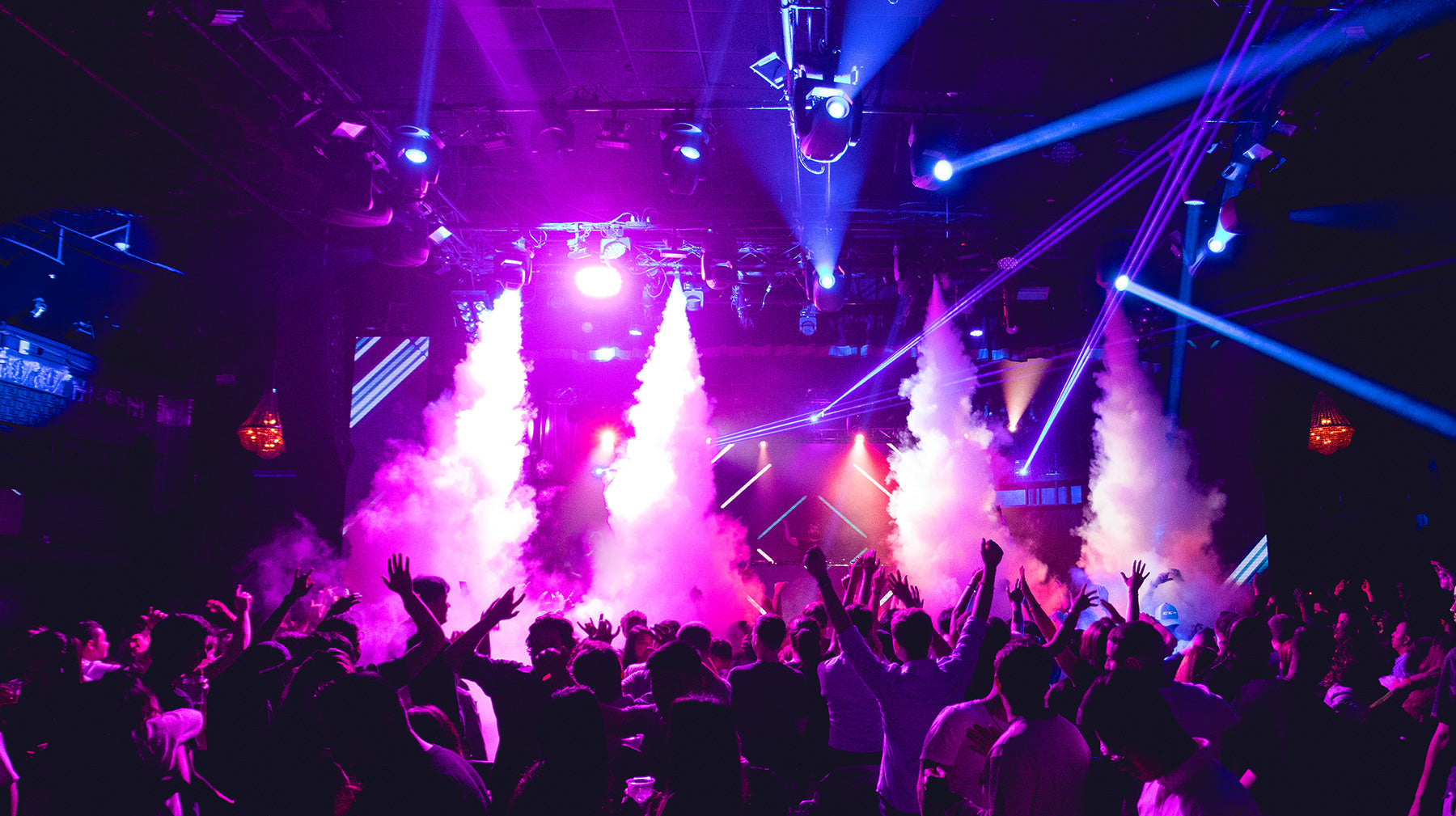 High-energy nightclub crowd used for nightclub marketing strategies