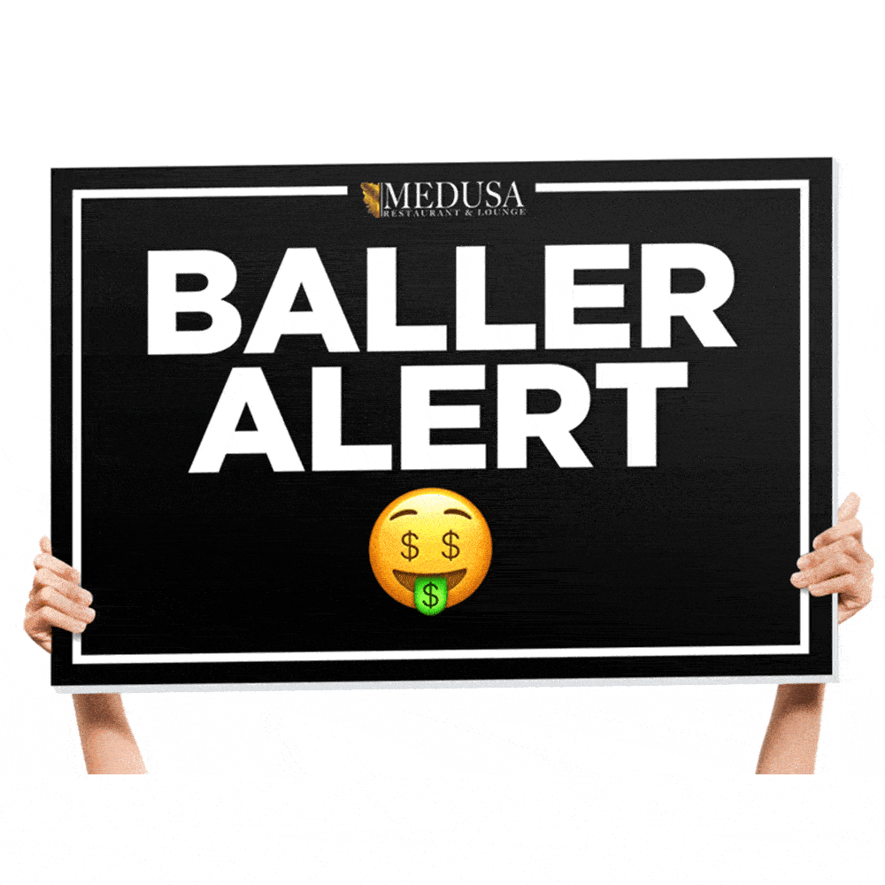 Custom bottle service signs used in a nightclub VIP presentation